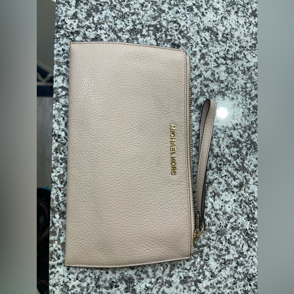 Used baby pink Michael Kors clutch bag